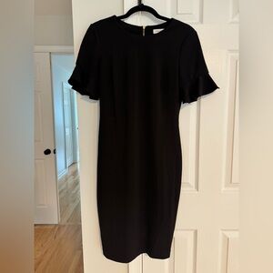 Black Calvin Klein dress with gold zipper